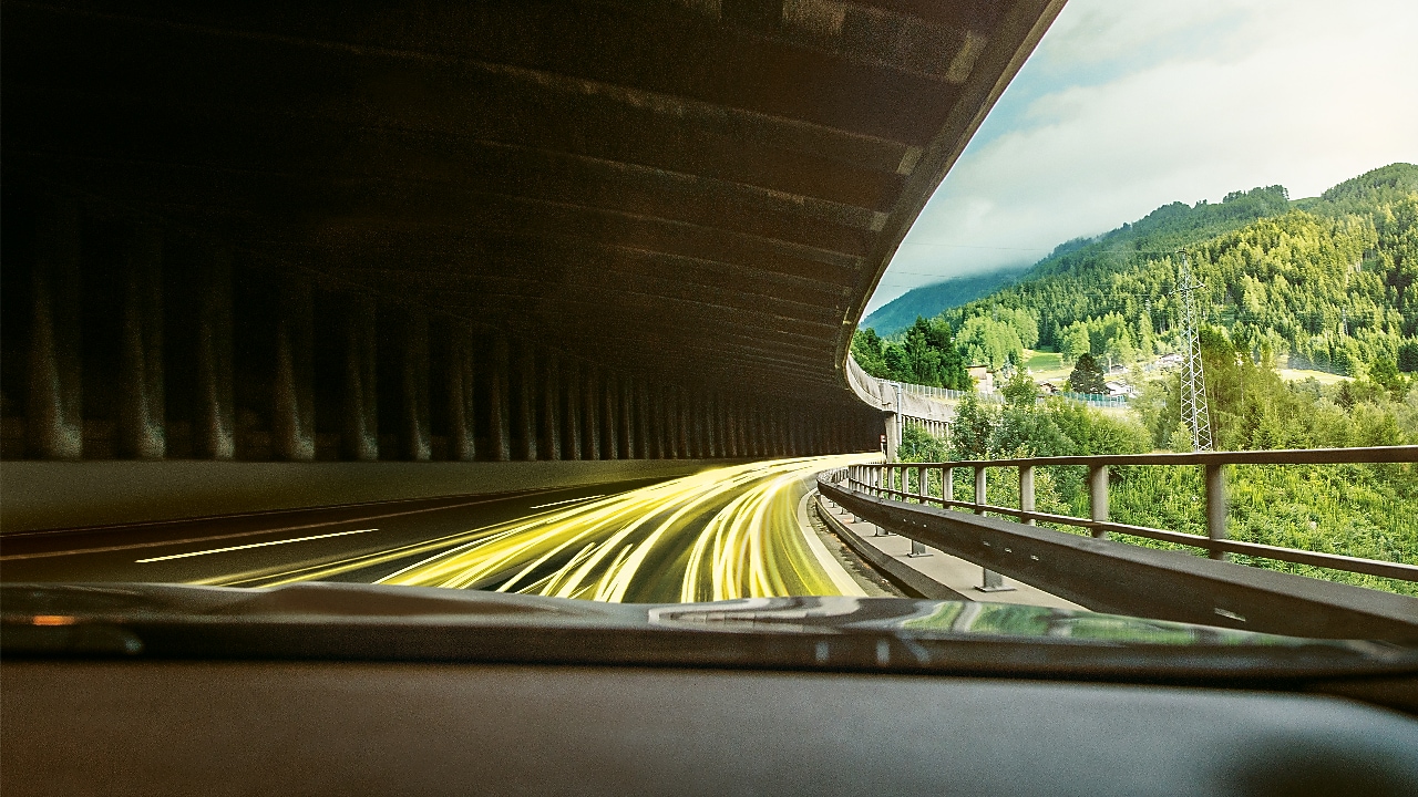 Silver BMW with man getting into it from above