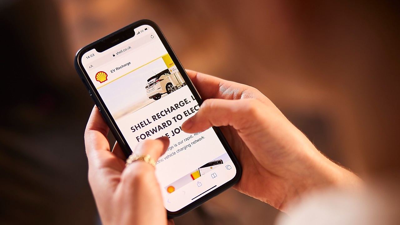 Driver parked at a Charge Point having used the 'Find an EV Charge Point feature'.