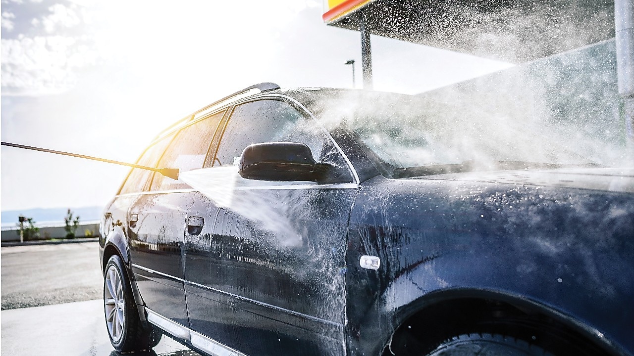 Close-up of a car being scrubbed