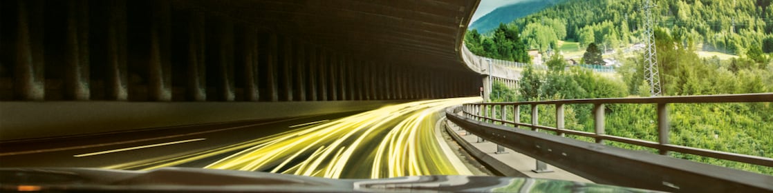 Silver BMW with man getting into it from above